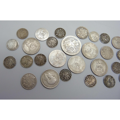 891 - A collection of silver coins, 28g, and half silver coins, 77g