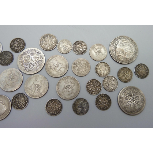 891 - A collection of silver coins, 28g, and half silver coins, 77g