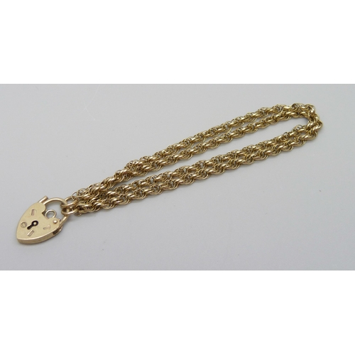 902 - A 9ct gold double strand rope twist bracelet with padlock clasp, 5.4g, 16cm