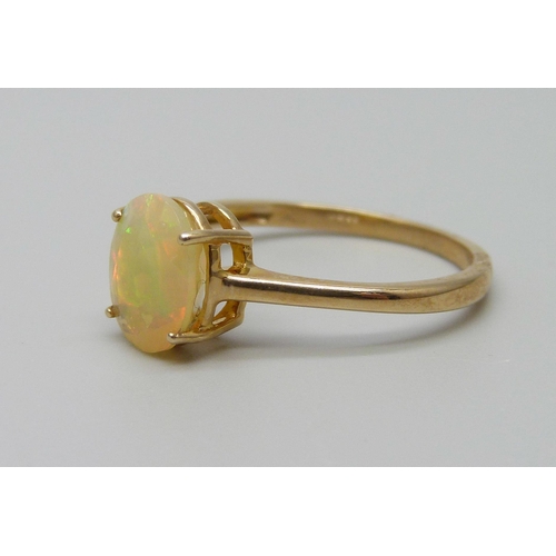 907 - A 10k gold and faceted opal ring, 1.7g, P