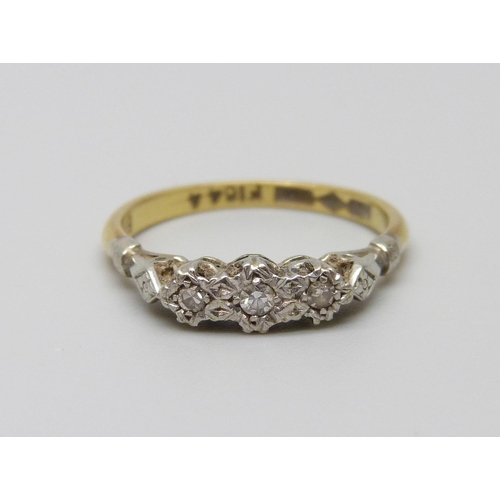 920 - An 18ct gold and platinum set three stone diamond ring, 2.8g, O