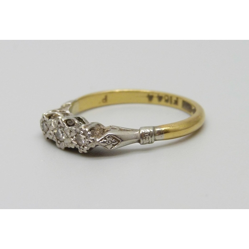 920 - An 18ct gold and platinum set three stone diamond ring, 2.8g, O