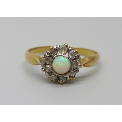 923 - An 18ct gold opal and diamond cluster ring, 2.6g, O