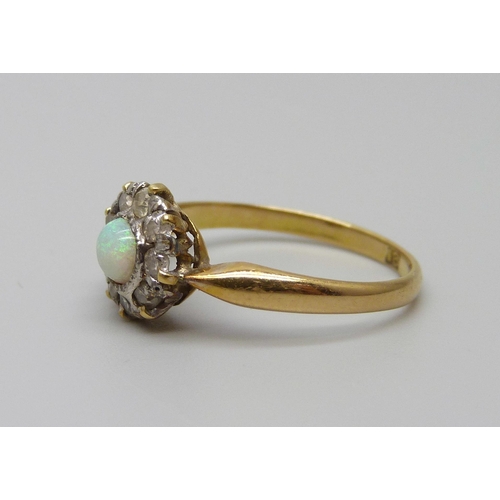 923 - An 18ct gold opal and diamond cluster ring, 2.6g, O