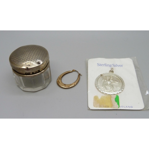 931 - A single 9ct gold earring, 0.4g, a silver St. Christopher pendant and a silver topped glass jar (top... 