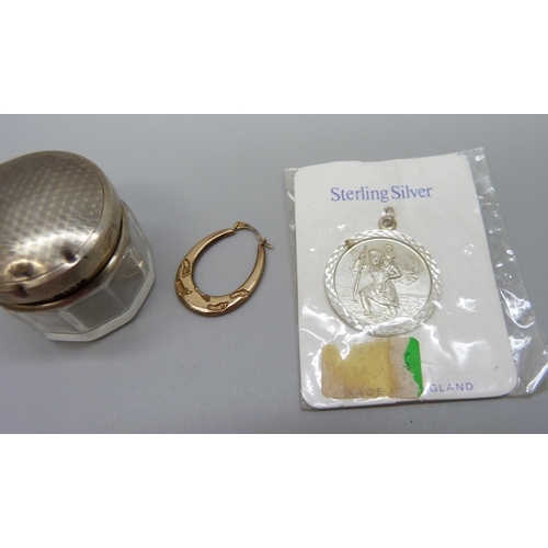 931 - A single 9ct gold earring, 0.4g, a silver St. Christopher pendant and a silver topped glass jar (top... 