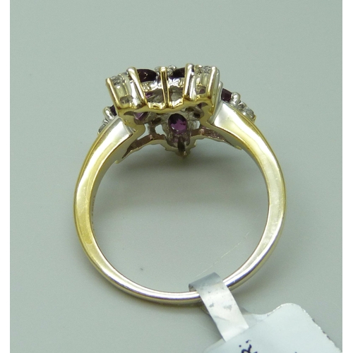 941 - A silver gilt almandine garnet and white topaz cluster ring, U