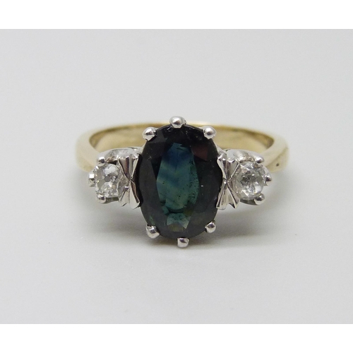 943 - A yellow metal, sapphire and diamond ring, stamped 18ct, 3.7g, L