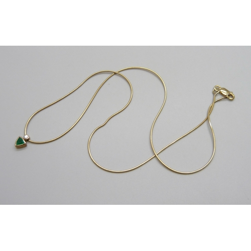 951 - A 9ct gold, emerald and diamond pendant on chain, 4.1g, 46cm