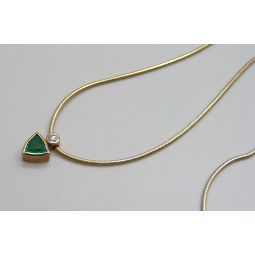 951 - A 9ct gold, emerald and diamond pendant on chain, 4.1g, 46cm