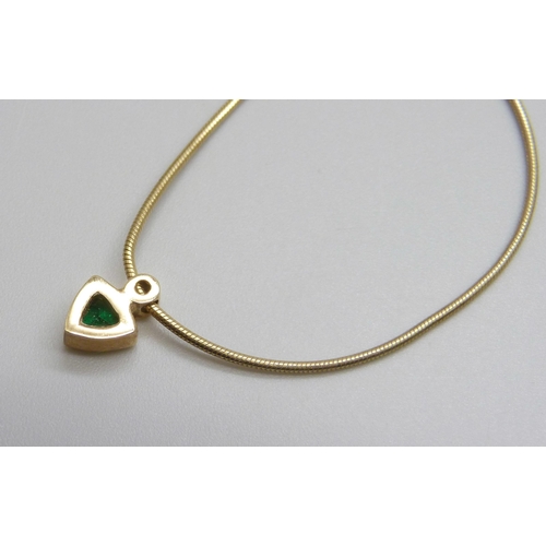 951 - A 9ct gold, emerald and diamond pendant on chain, 4.1g, 46cm