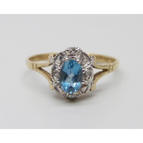 983 - A 9ct gold, topaz and diamond cluster ring, 1.7g, P