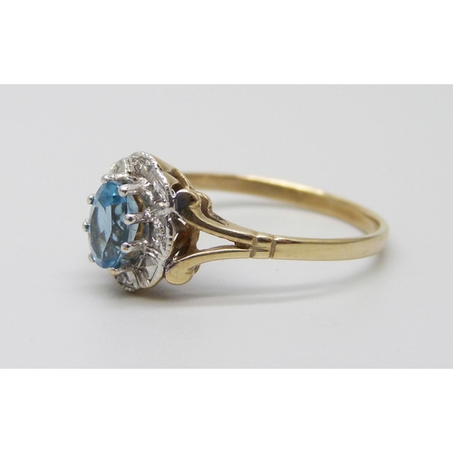 983 - A 9ct gold, topaz and diamond cluster ring, 1.7g, P