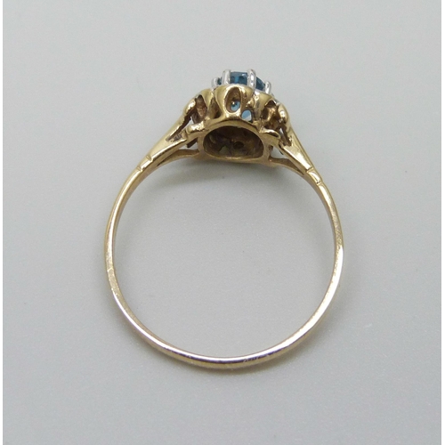 983 - A 9ct gold, topaz and diamond cluster ring, 1.7g, P