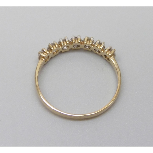 984 - A 9ct gold ring set with five white stones, 1.3g, N