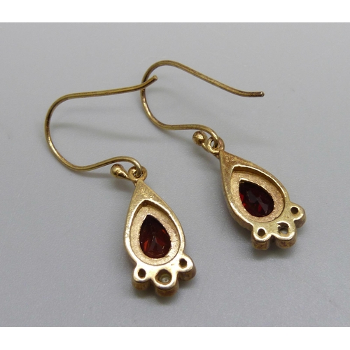 989 - A pair of silver gilt, garnet and pearl drop earrings, 3cm including hook