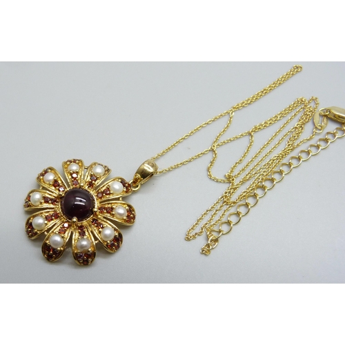 994 - A silver gilt garnet and pearl pendant on a chain, 5.8g, 3.3cm including bale