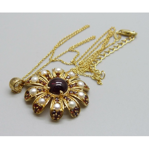 994 - A silver gilt garnet and pearl pendant on a chain, 5.8g, 3.3cm including bale