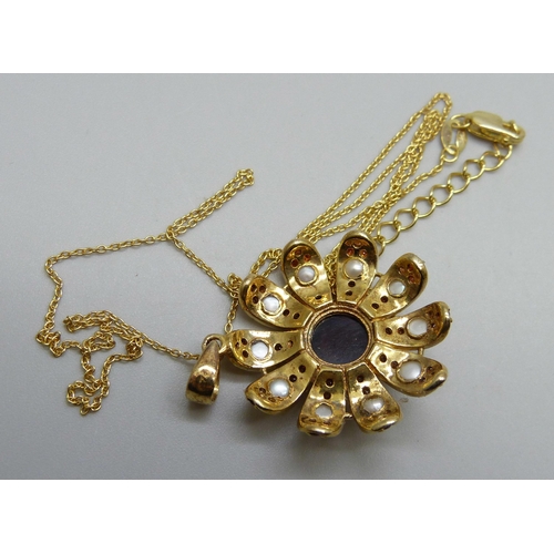 994 - A silver gilt garnet and pearl pendant on a chain, 5.8g, 3.3cm including bale