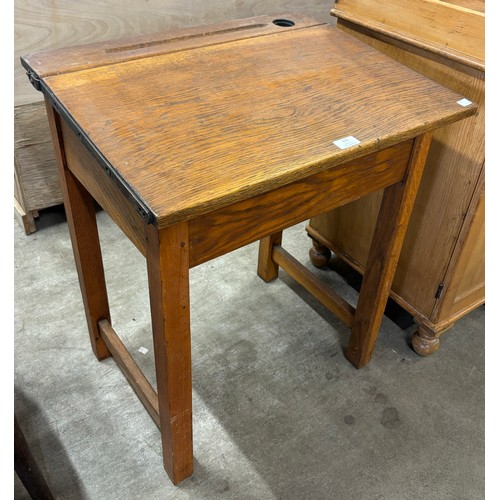 221 - An early 20th Century oak school desk