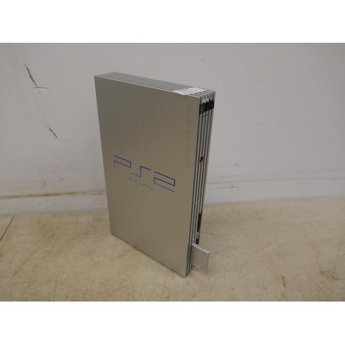 5060 - A satin silver Playstation 2 - boxed with power supply, av cables, 2 controllers and a quantity of P... 