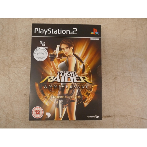 5060 - A satin silver Playstation 2 - boxed with power supply, av cables, 2 controllers and a quantity of P... 