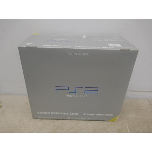 5060 - A satin silver Playstation 2 - boxed with power supply, av cables, 2 controllers and a quantity of P... 