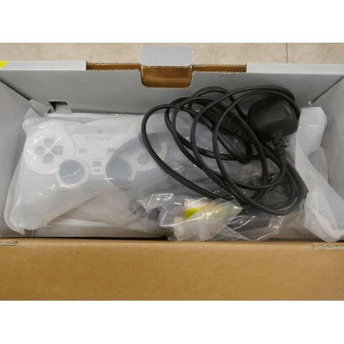 5060 - A satin silver Playstation 2 - boxed with power supply, av cables, 2 controllers and a quantity of P... 