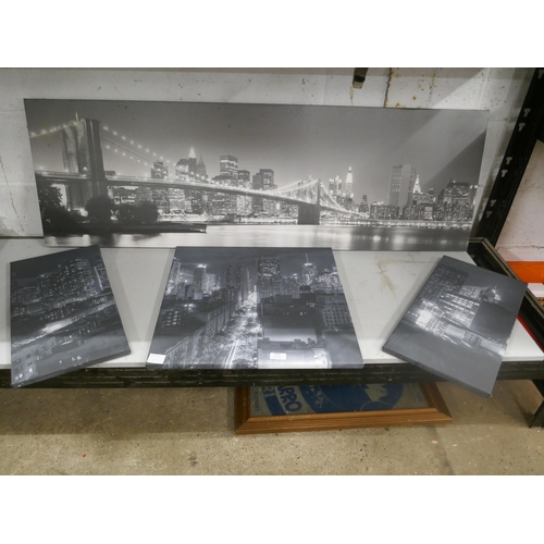 5064 - A canvas print of the Brooklyn Bridge and trio of canvas prints depicting a city skyline