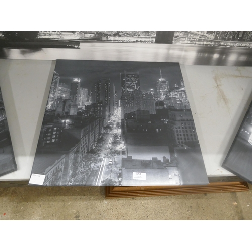 5064 - A canvas print of the Brooklyn Bridge and trio of canvas prints depicting a city skyline