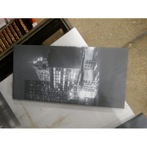 5064 - A canvas print of the Brooklyn Bridge and trio of canvas prints depicting a city skyline