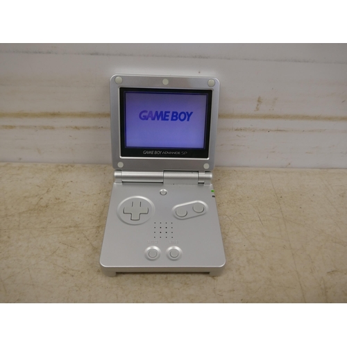 5074 - A Gameboy Advance SP handheld games console, in box with charging cable