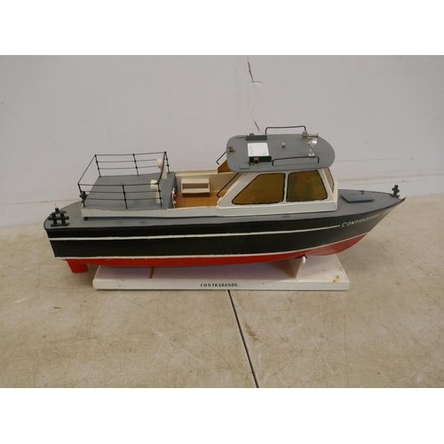 5093 - Three model boats including a model contrabande boat with display stand