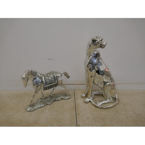 5097 - A silver coloured cheetah ornament and a silver coloured horse ornament