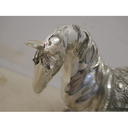 5097 - A silver coloured cheetah ornament and a silver coloured horse ornament