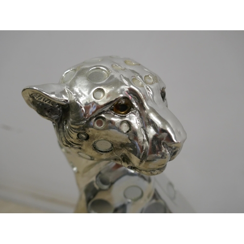 5097 - A silver coloured cheetah ornament and a silver coloured horse ornament