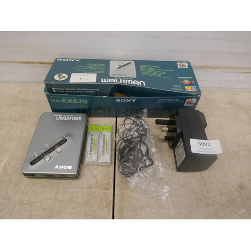 5082 - A Sony WM-EX670 Walkman cassette player with rechargeable battery, battery charger and headphones