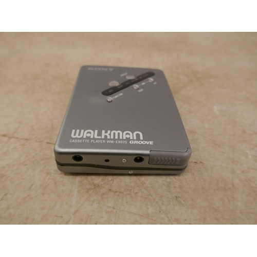 5082 - A Sony WM-EX670 Walkman cassette player with rechargeable battery, battery charger and headphones