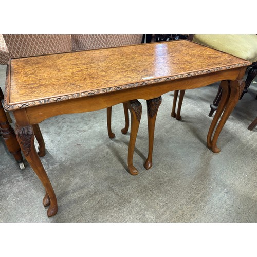 228 - A Queen Anne style burr walnut nest of tables