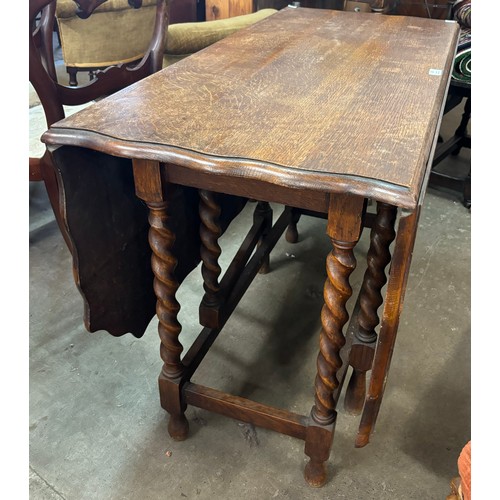 230 - An early 20th Century oak barleytwist gateleg table