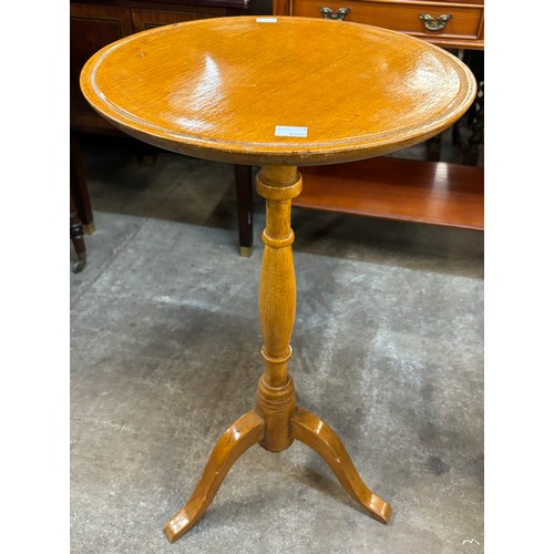 230A - A Victorian oak tripod lamp table