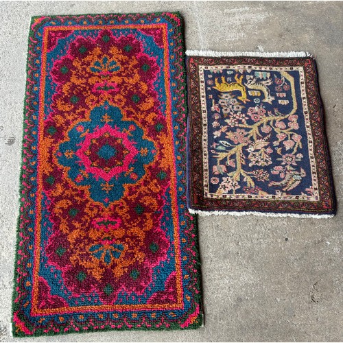 233 - An eastern hand knotted door mat and wall hanging rug