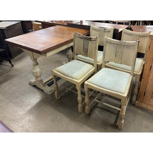 245 - A painted draw-leaf table and four chairs