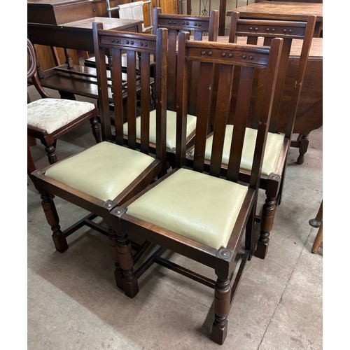 241A - A set of four early 20th Century oak dining chairs