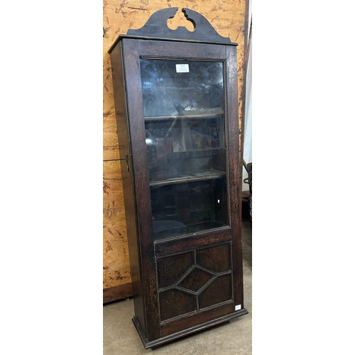 251 - An early 20th Century oak wall hanging display cabinet