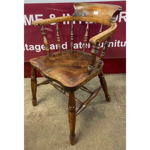 99 - A Victorian elm and beech smokers bow chair