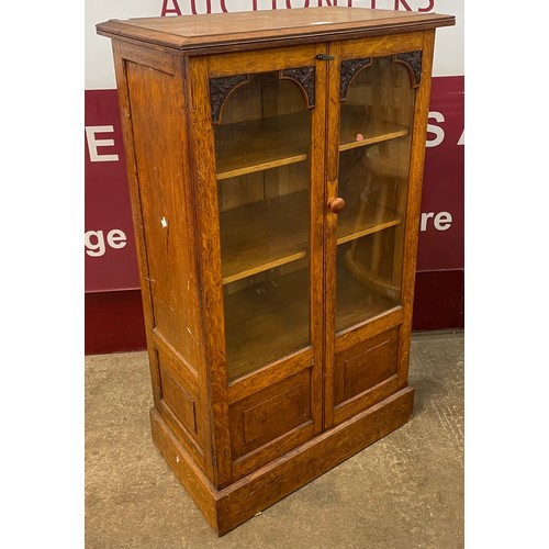 103 - A small Victorian carved oak bookcase