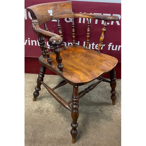 116 - A Victorian elm smokers bow chair