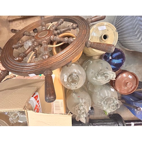 294 - Assorted items, comprising; glass jars, demi johns, a ships wheel, a ceiling light, etc.