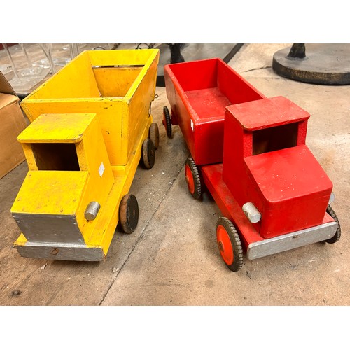 298 - Two painted vintage toy trucks